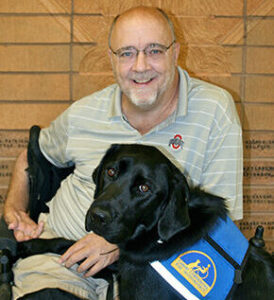 person with Canine Companions service dog