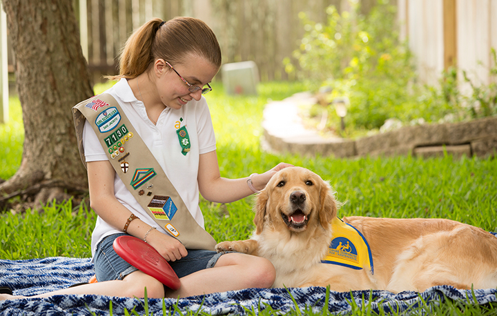 child with Canine Companions service dog
