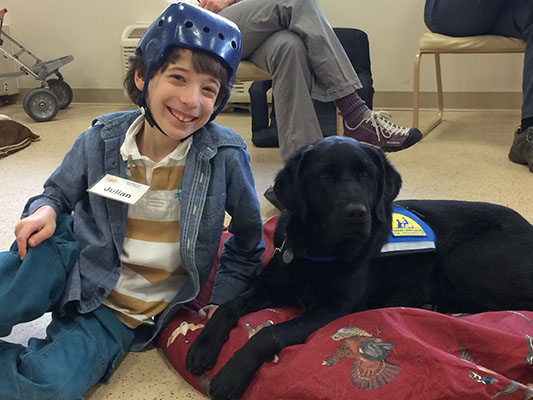 child with Canine Companions service dog