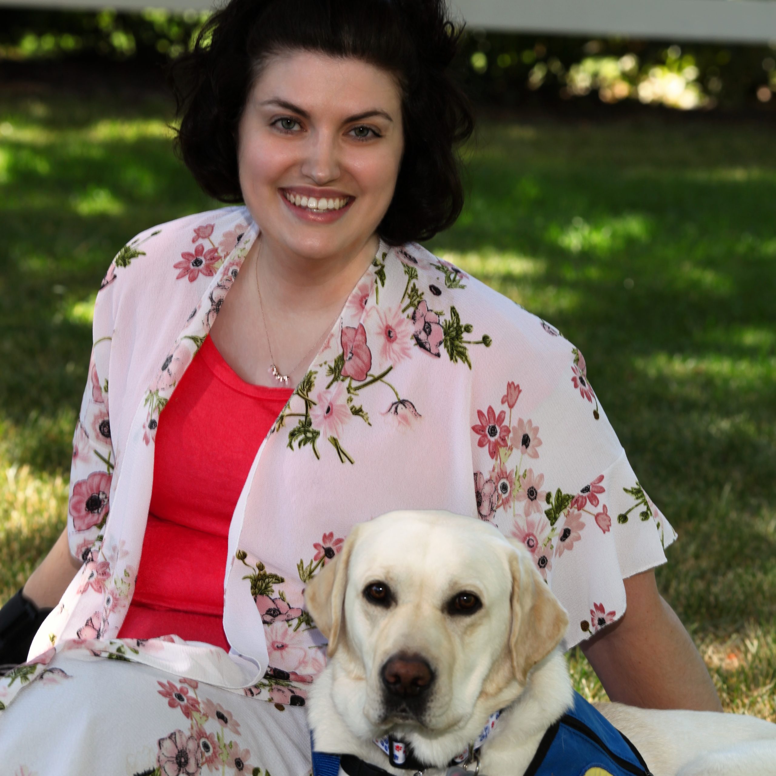 Volunteer and graduate Lacee Clinger with her yellow hearing dog, Rhenny