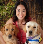 Leighann Malilay with 2 yellow labs