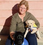 Lorrie Clark with yellow and black lab