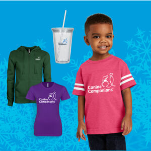 Little boy wearing a t-shirt, a couple of shirts and a glass with cup with Canine Companions brand
