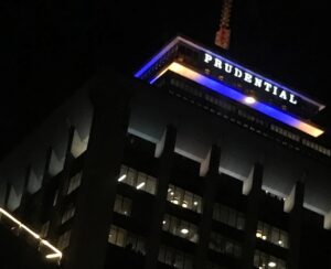Prudential Center in Boston lit in Canine Companions yellow and blue