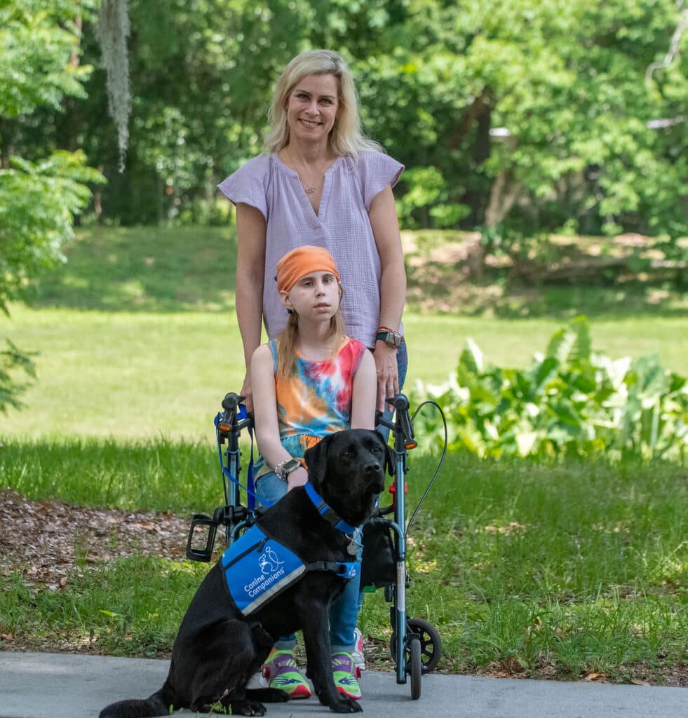 mother and daughter with service dog