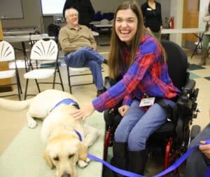 Woman using wheelchair and her Canine Companions service dog