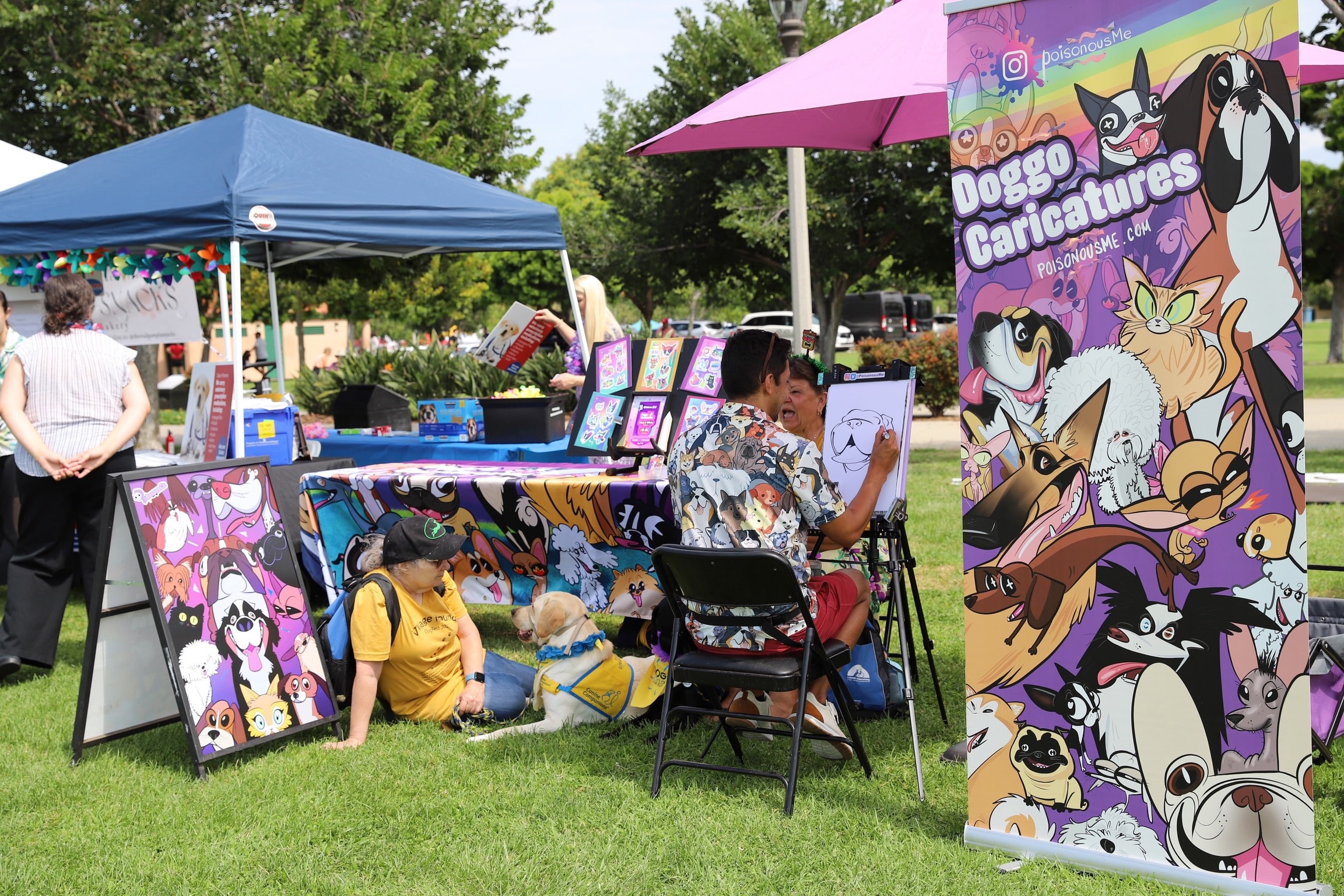 Booth and a caricature artist at dogfest