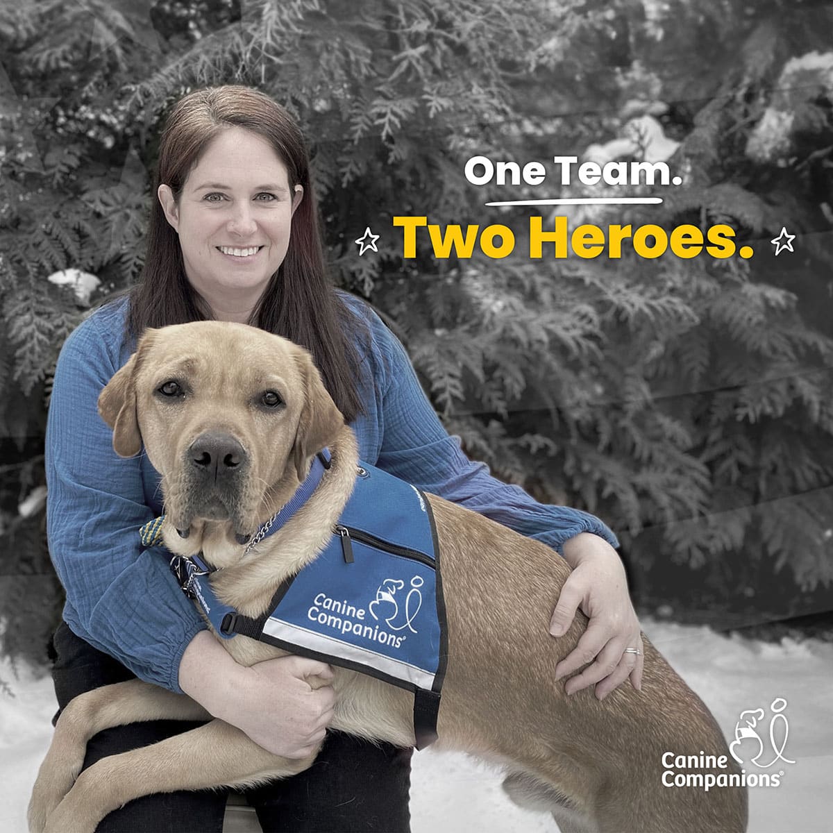 a smiling woman sits with her yellow lab service dog. The words below say One Team Two Heroes