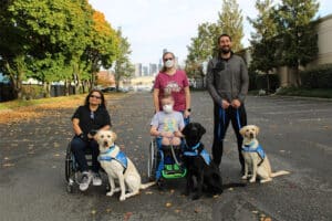 three first clients at puget sound field office with their service dogs