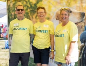 A group of volunteers smile at DogFest.