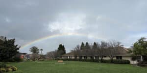 dark clouds and rainbow over the santa rosa campus