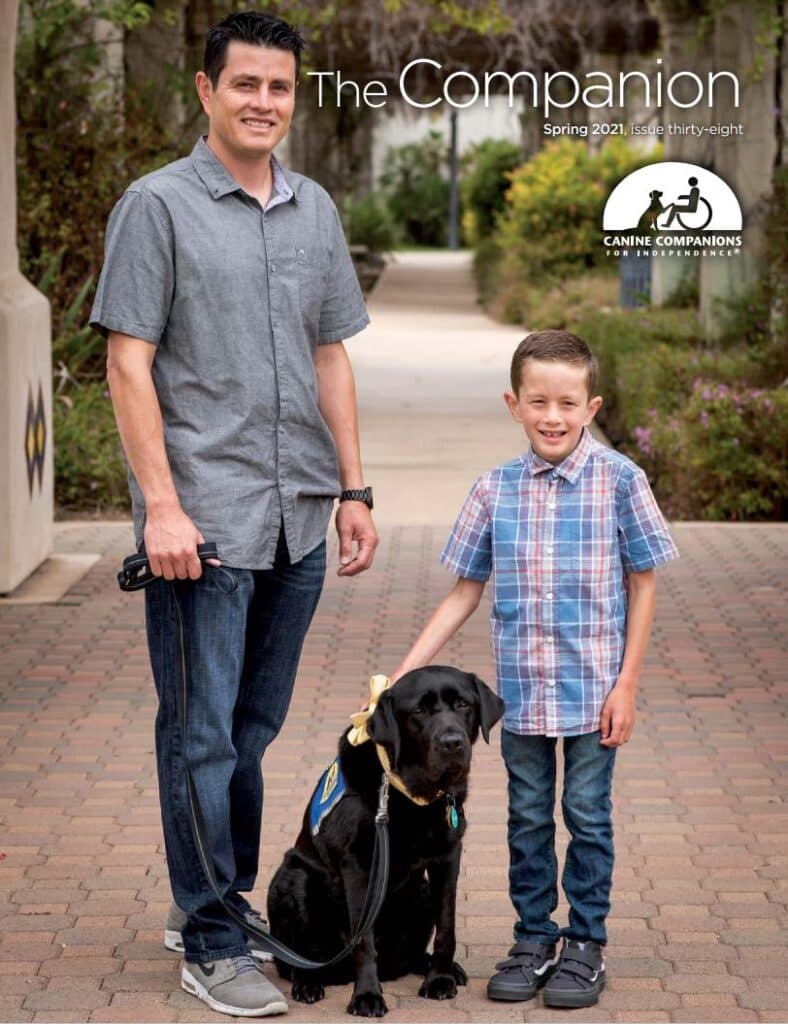 cover of the companion issue 39 featuring a man and his son with their black lab service dog