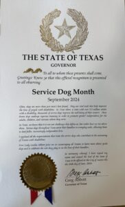 Service Dog Month proclamation from the Governor of Texas for September 2024, with a gold seal and signature.