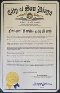 City of San Diego proclamation document declaring National Service Dog Month, with official seal and signature of Todd Gloria, Mayor of San Diego.