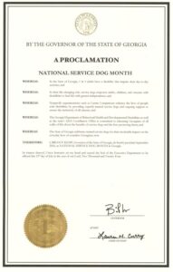 A proclamation from the Governor of the State of Georgia declaring September 2024 as National Service Dog Month, highlighting the role of service dogs in empowering individuals with disabilities and recognizing the contributions of nonprofit organizations and governmental departments.