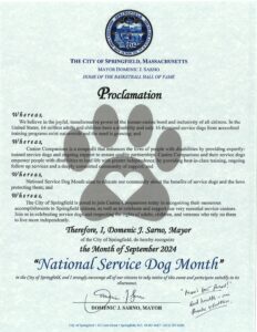 A proclamation from the city of Springfield, Massachusetts, by Mayor Domenic J. Sarno declaring September 2024 as "National Service Dog Month" to recognize the benefits of service dogs and their impact on people with disabilities.