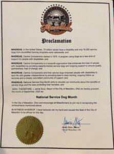 A proclamation document from the City of Massillon, Ohio, declaring September 2025 as National Service Dog Month. The document outlines the importance of service dogs, citing facts about disabilities, the role of Canine Companions, and urges the community to recognize these achievements. The proclamation is signed by Mayor Jamie Slutz and features the official city seal.