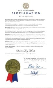 Proclamation from the Governor of Tennessee declaring September 2025 as Service Dog Month, emphasizing the importance of service dogs for individuals with disabilities, their healing abilities, and the need for training and support for effective partnerships. The document is signed by Governor Bill Lee and features the state seal.