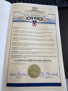 A proclamation from the State of Ohio recognizing September 2025 as National Service Dog Month, featuring the state seal and signatures of Governor Mike DeWine and Lieutenant Governor Jim Tressel.