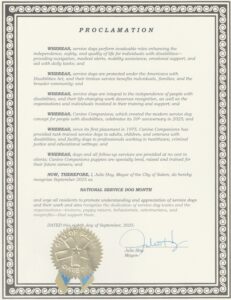 A formal proclamation from Julie Hoy, Mayor of Salem, declaring September 2025 as National Service Dog Month. The document highlights the roles of service dogs in enhancing the lives of individuals with disabilities, acknowledges their legal protections, and recognizes the contributions of Canine Companions. It features a decorative border, the City of Salem seal at the bottom, and a signature from the mayor.