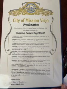 A proclamation document from the City of Mission Viejo declaring September 2025 as National Service Dog Month, highlighting the transformative power of service dogs for individuals with disabilities, and encouraging community awareness and support for service dog programs.